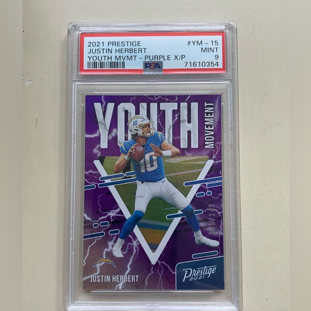 71610354 Justin Herbert 2021 Prestige Youth Mvmnt Xtra Points Purple /149 PSA 9